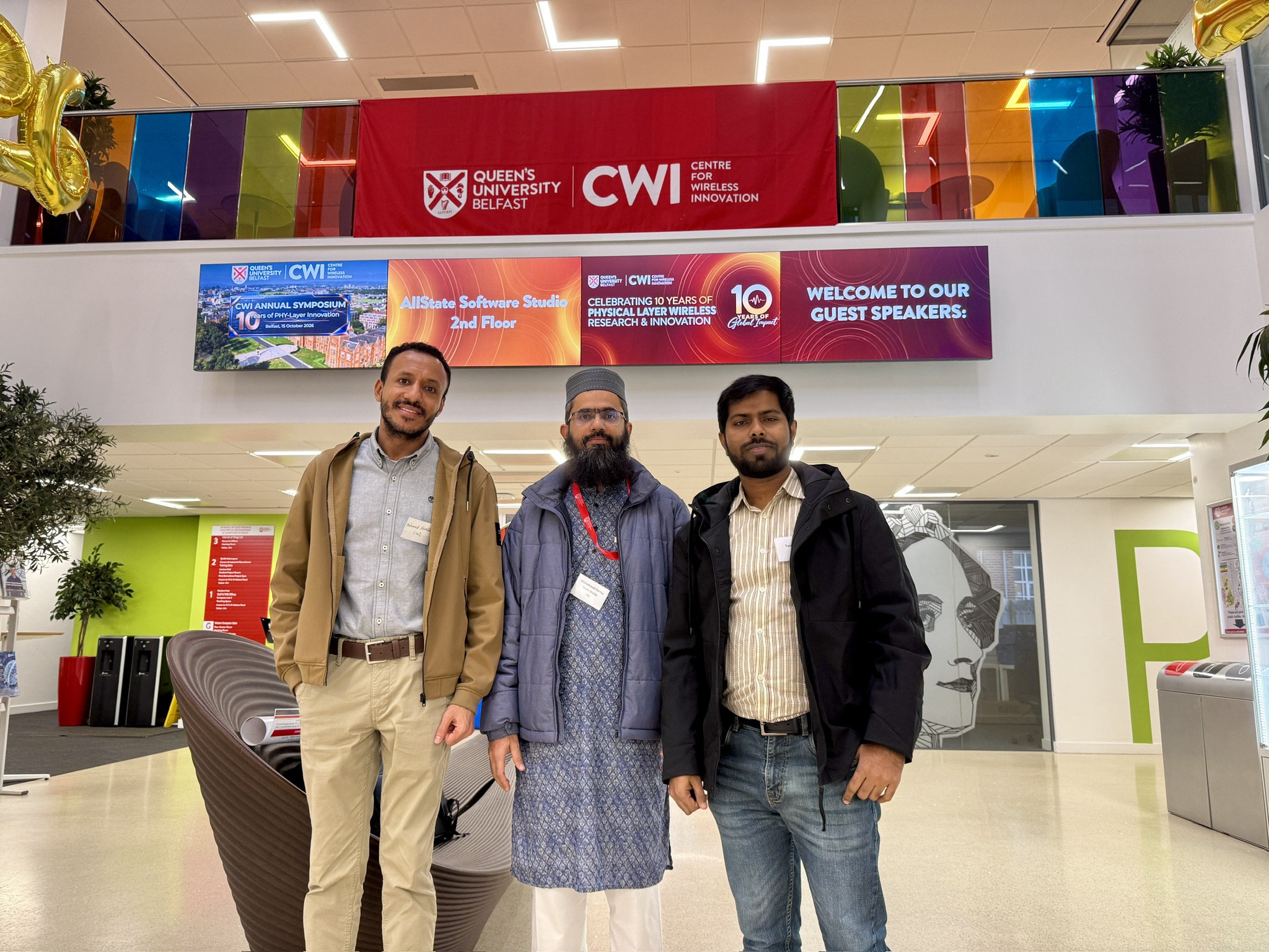 Md Tarek Hassan with two colleagues at the CWI Symposium 2026